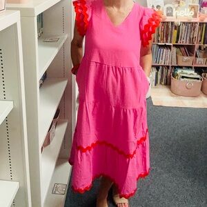 Pink dress with rickrack and ruffle sleeves